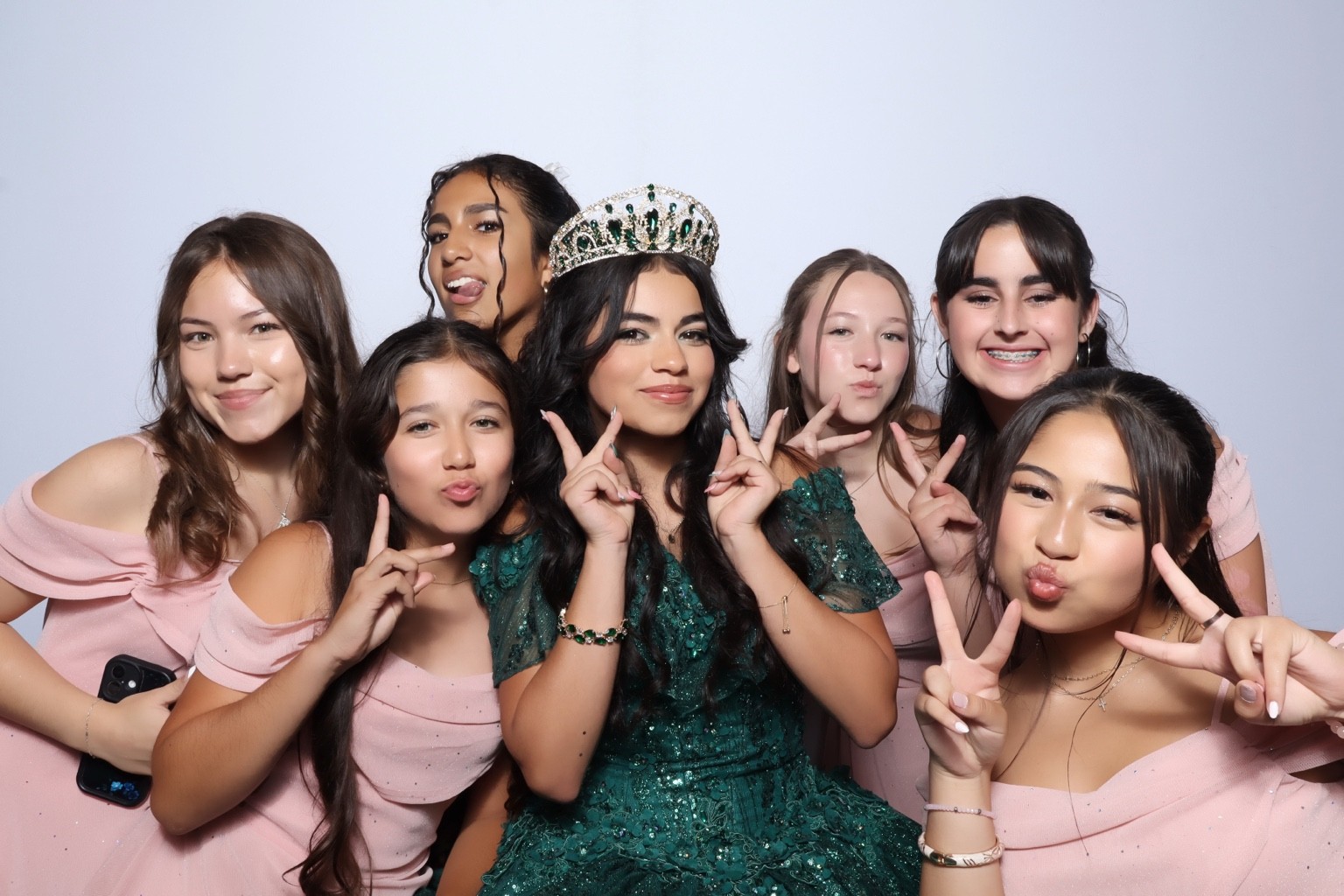 Quinceañera guest of honor surrounded by friends