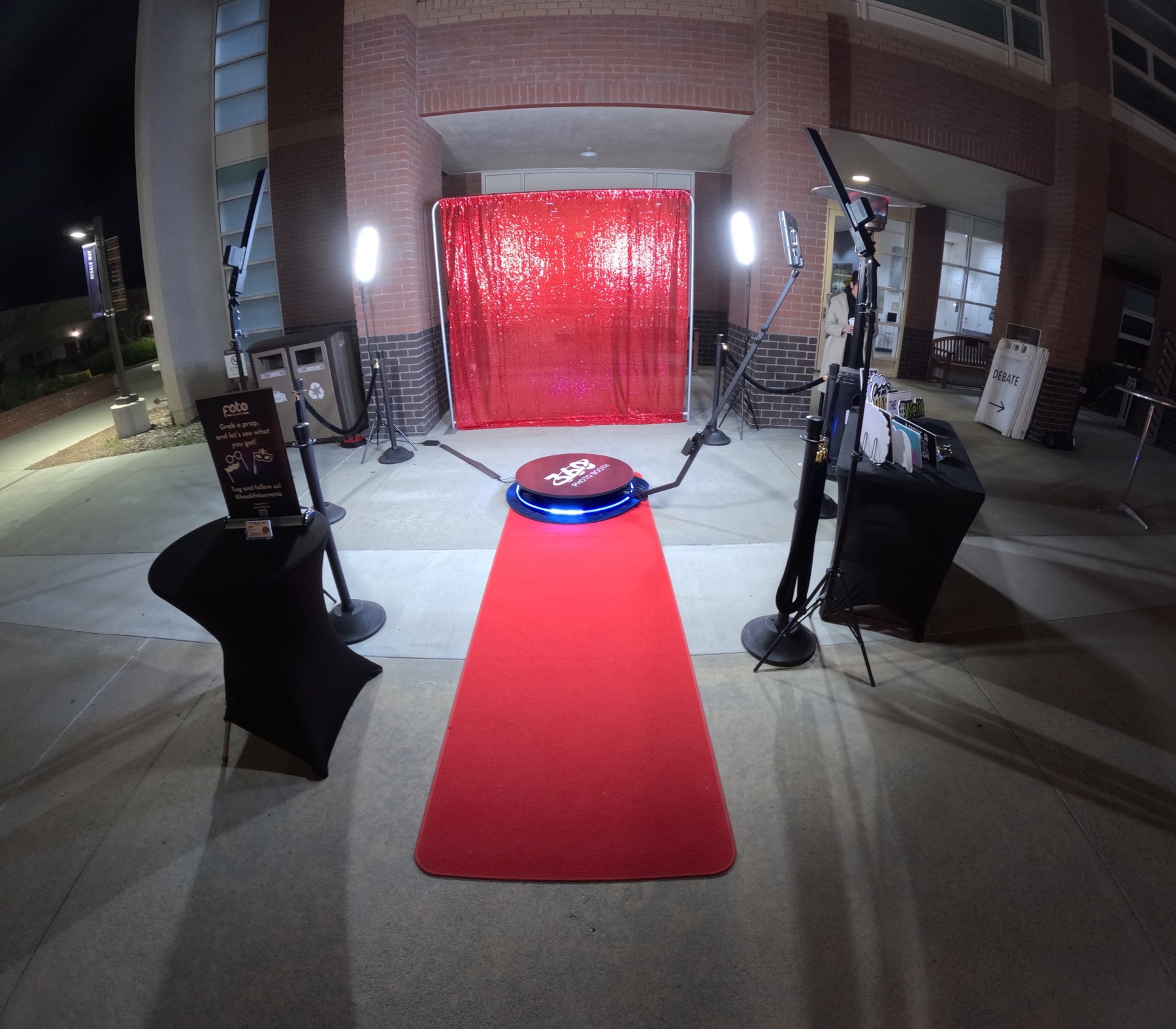360 Booth setup with a red carpet, stanchions and red backdrop